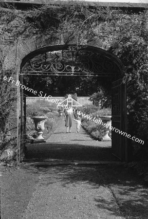 DUNSANY CASTLE GARDEN THROUGH GATE WITH VICTORIA DE RUTZEN AND 